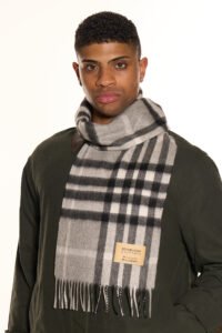 An Edinburgh Lambswool stole alongside some accessories.
