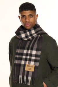 Neutral-toned cashmere scarves arranged in a luxury boutique setting