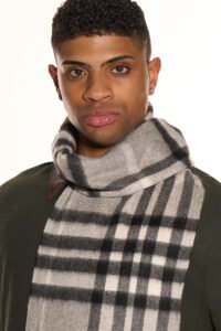 People of different cultures sharing gifts and wearing iconic Scottish cashmere scarves.