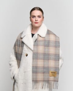 Detailed view of tartan and classic patterns of Scottish cashmere scarves, highlighting expert craftsmanship.