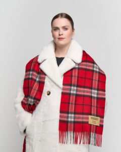 A beige cashmere scarf elegantly displayed in a premium gift box.